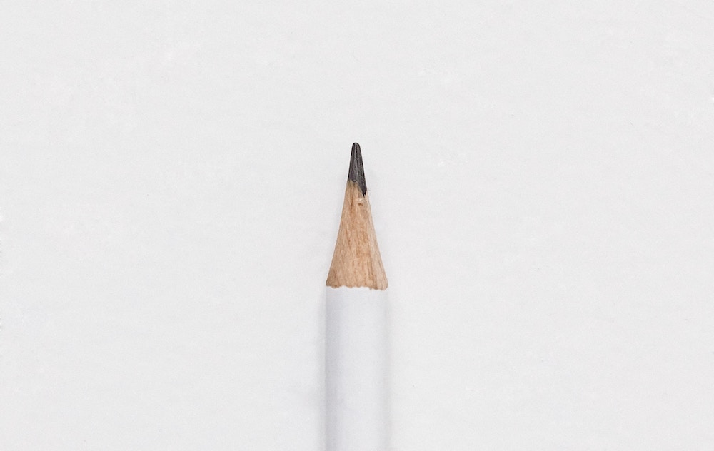 how to choose word of the year - pencil on a white background choose a word for 2020 amp up your website