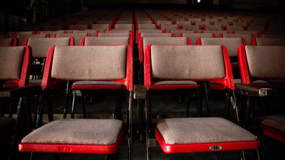 event chairs in front of a speaker's stage